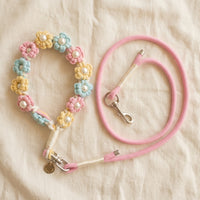 The Pearl & Blossom Dog Leash and matching collar set in Pastel Candy by Paw's Line, coiled neatly on a textured linen background.