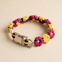 Paw's Line macrame flower dog collar. color:Lemon Dragonfruit. Displayed as a standalone loop on a warm cream backdrop with a metal buckle.
